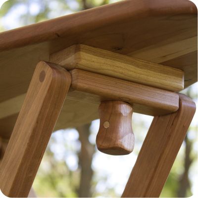 Cherry Wood Ironing Board, underneath, the screw that holds the board in place when standing