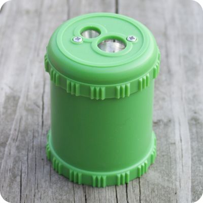 Green Solid Drum Pencil Sharpener from Palumba, offering waldorf toys, natural toys, organic clothing, and art supplies for inspired natural living
