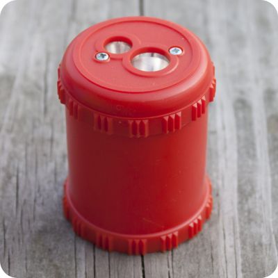 Red Solid Drum Pencil Sharpener from Palumba, offering waldorf toys, natural toys, organic clothing, and art supplies for inspired natural living