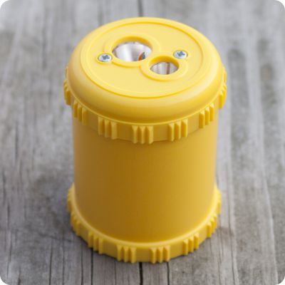 Yellow Solid Drum Pencil Sharpener from Palumba, offering waldorf toys, natural toys, organic clothing, and art supplies for inspired natural living